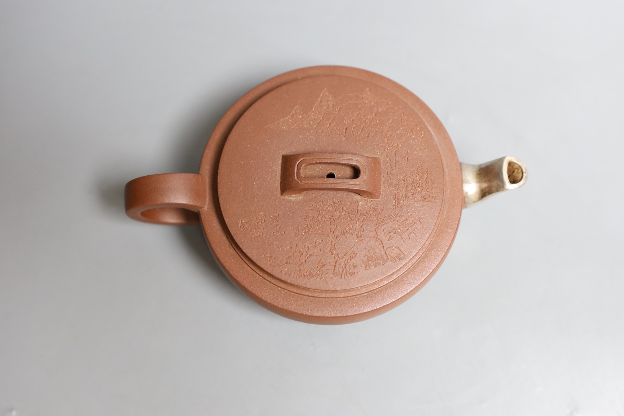 A Chinese Yixing drum-shaped teapot, Qing dynasty, 6cms high, 15.5cm long